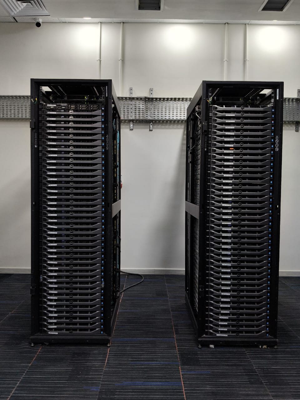 Two racks of Dell PowerEdge servers fully populated and commissioned in a data centre built by Stark Technology