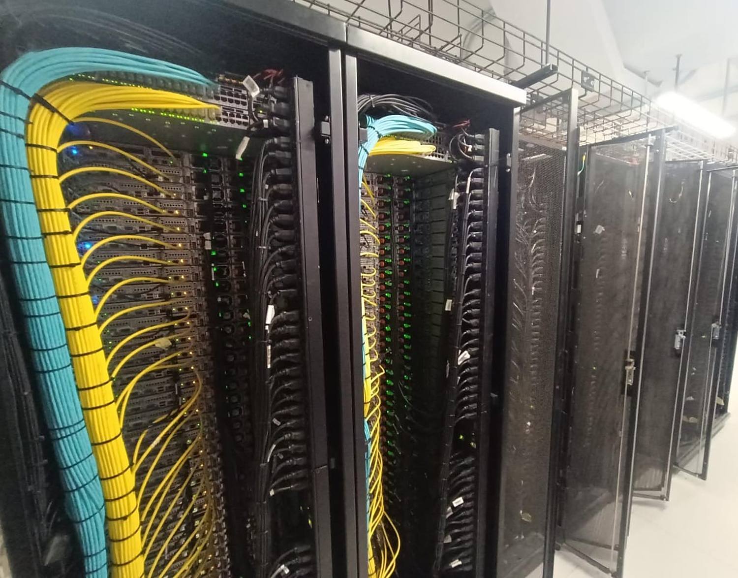 A data centre aisle built and cabled by Stark Technology