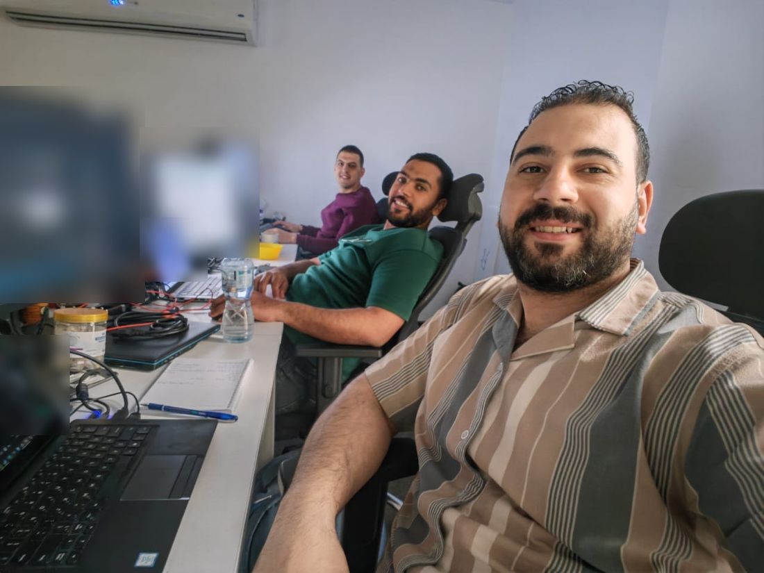 Three Stark Technology engineers working together in the office