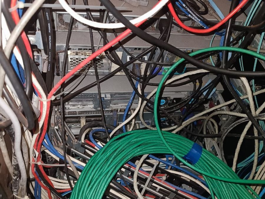 A comms rack found in an unmanaged condition
