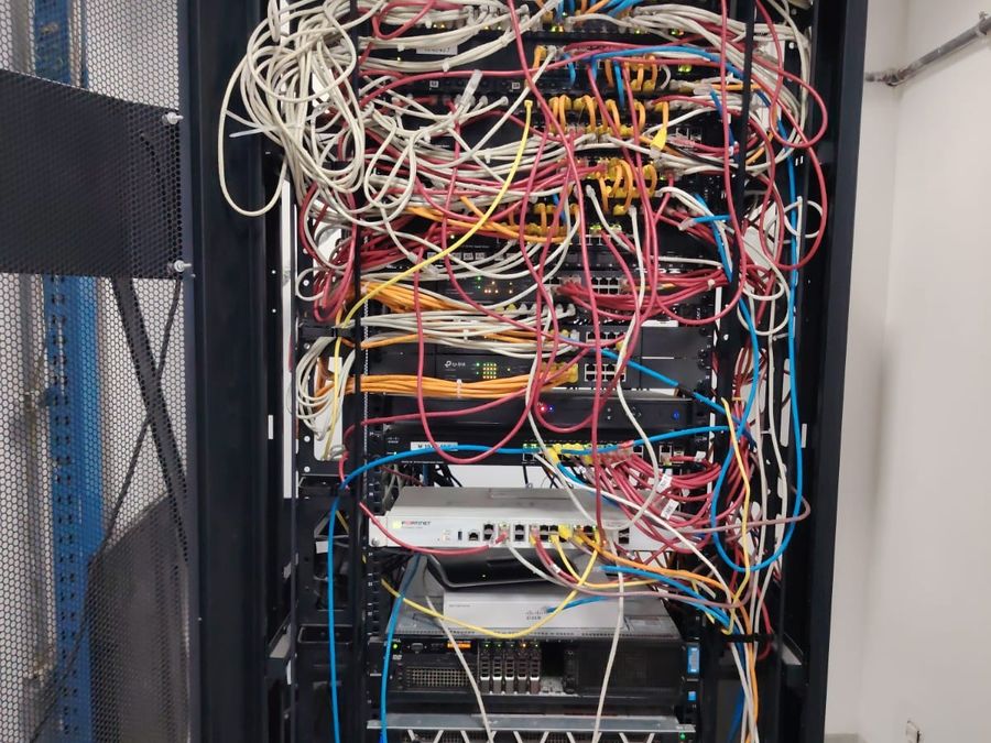 An inherited rack with unmanaged cabling