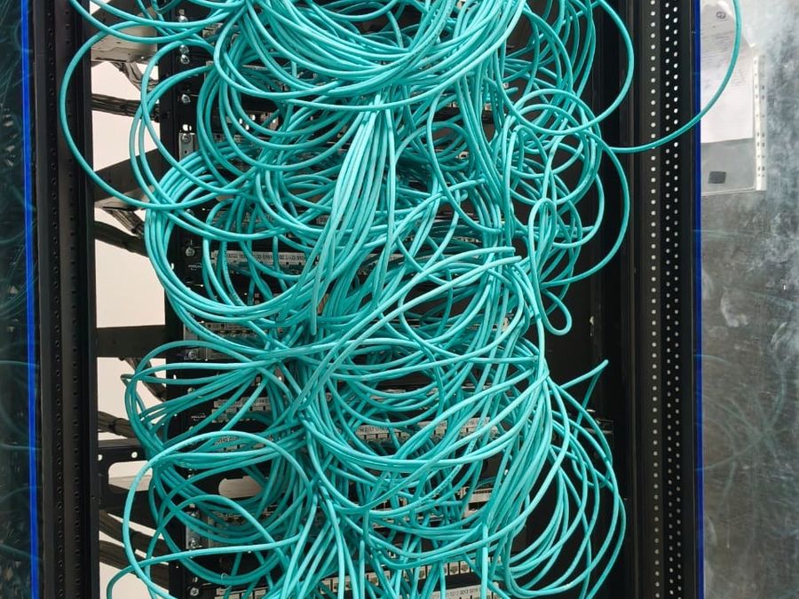 Undressed cable slack in an inherited rack