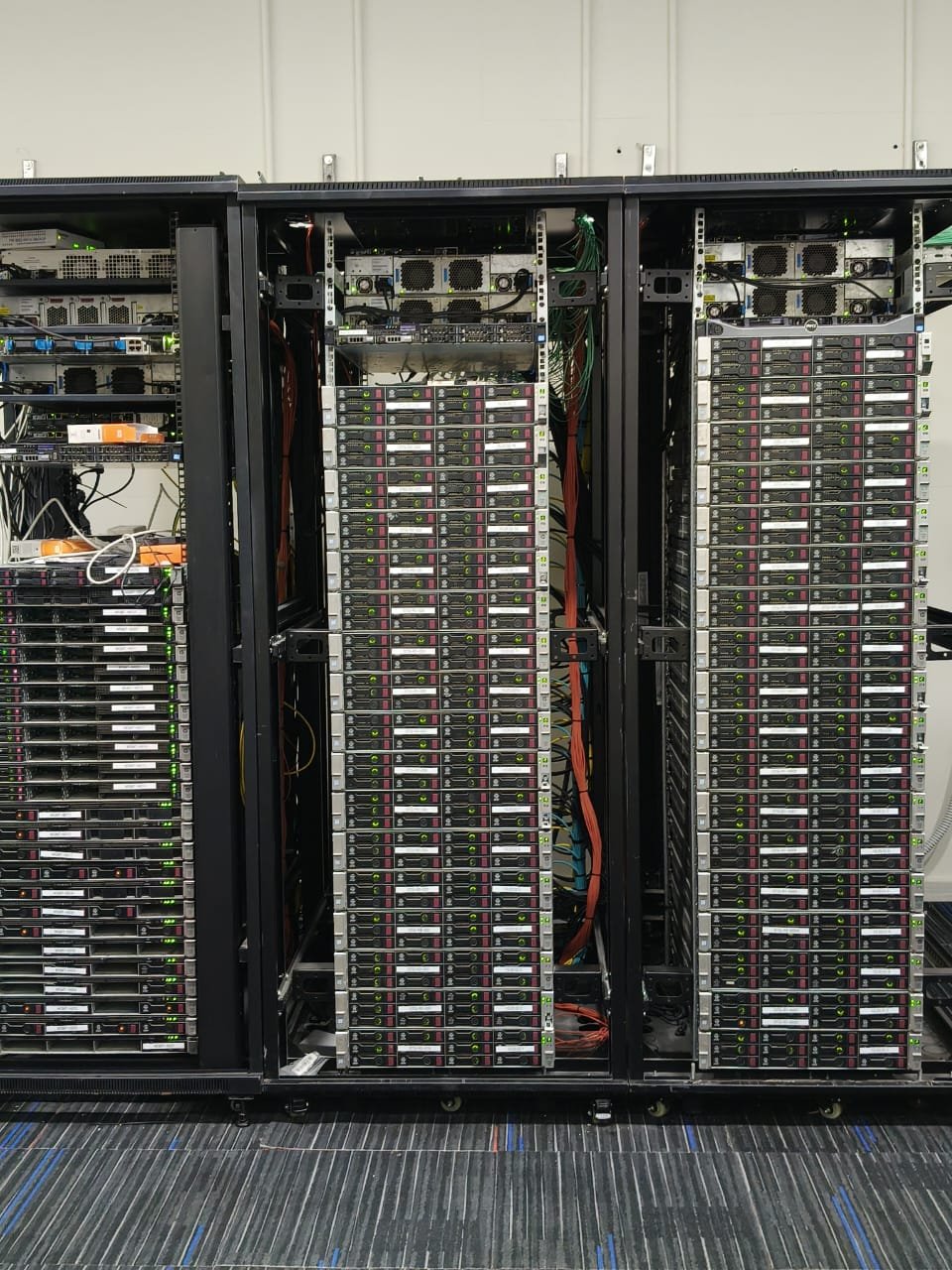 Three racks of HPE ProLiant compute nodes fully populated in a data centre built by Stark Technology