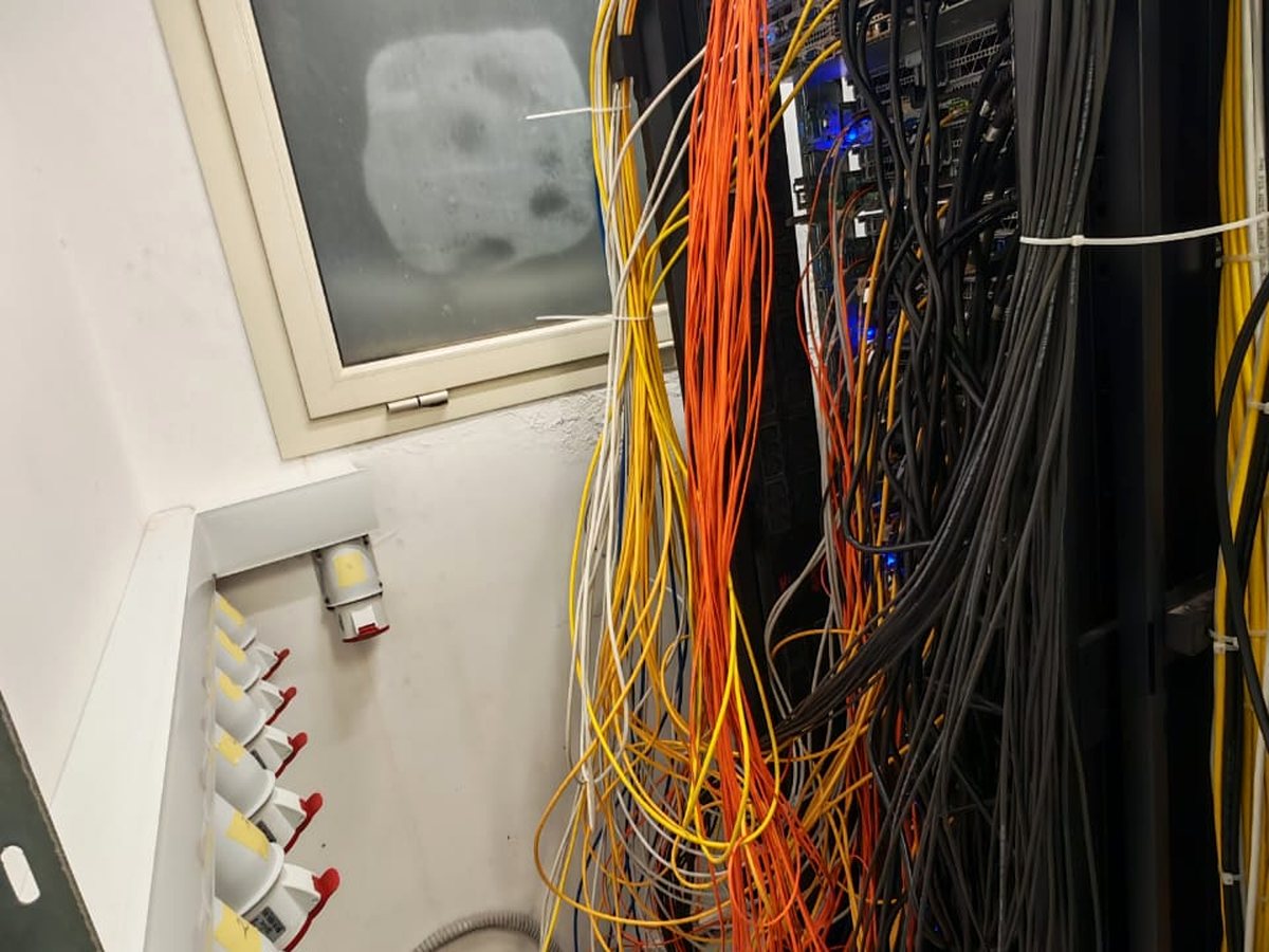 A comms rack found with unmanaged patch cabling
